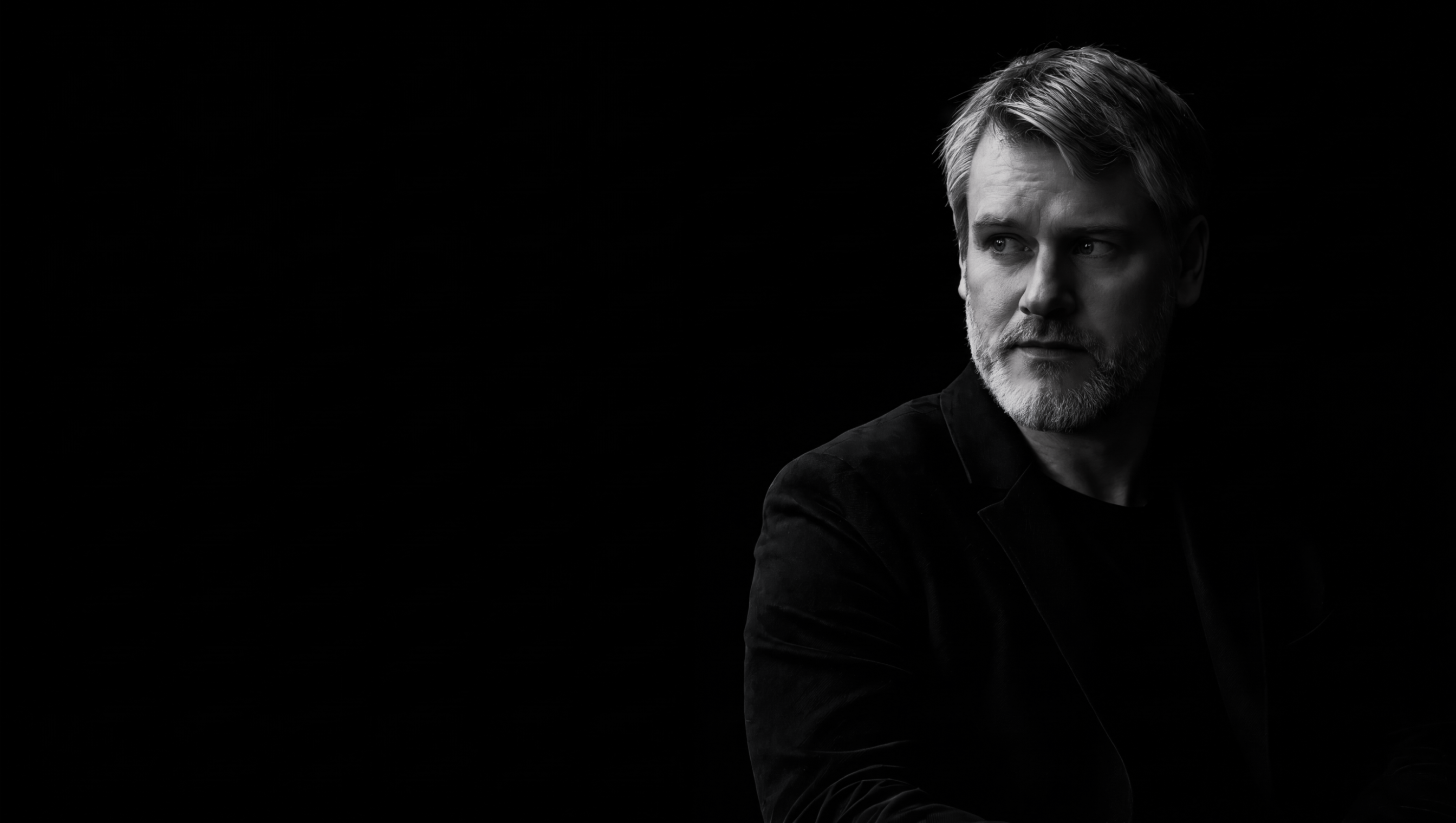 Black-and-white portrait of Paweł Sobecki